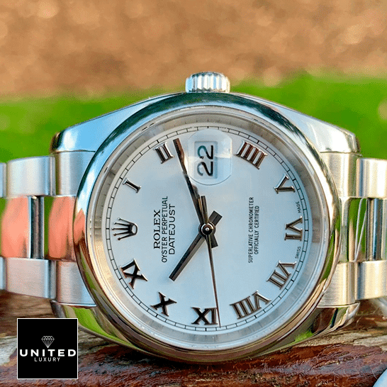 Rolex Oyster Perpetual Datejust White Dial 116200 Replica on the Table